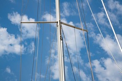 sailing boat mast and blue cloud sky close up