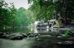 Camping and tent near the river in nature park
