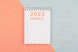 Goals 2022 new year motivation notebook with a blank list. Inspiration for a fresh start. High-quality photo.