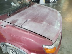 Car Paint Oxidation and Faded Paint. bad quality car paint eroded weather.  dull and not shiny paint
