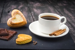 Coffee and sweets on a wooden table