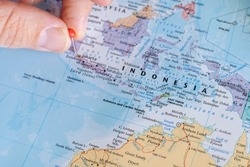 Indonesia pin on a world map. Indonesia travel destination planning pinned
