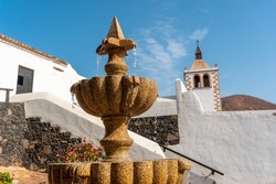 Detail of the water in the fountain next to the white church of Betancuria, west coast of the island of Fuerteventura, Canary Islands. Spain