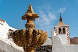 Detail of the water in the fountain next to the white church of Betancuria, west coast of the island of Fuerteventura, Canary Islands. Spain