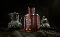 Chinese antique tea leaf iron storage jar (Characters chinese is Name of the tea), Chinese antique teapot (Characters chinese is Double Happiness) and Silver antique incense burner on dark background.