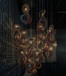 Softly shining hanged  lamps with Braided Colorful Ropes, which means in Chinese Lucky Number Eight with dark background. Beautiful decor for the interior, 8 infinity unlimited lucky signs concept,