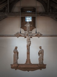 The Rood, hanging above the altar. Jesus hanging on the cross and The Virgin Mary and St.John (The evangelist) statues at Our Lady and St Nicholas Church, The figure of Jesus Christ, Space for text, S