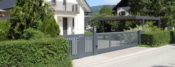 a new house with a metal sliding gate