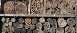 a large insect hotel in a meadow