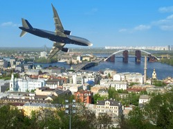 Passenger aircraft carries tourists to Europe. In the photo the city of Kiev. Ukraine.