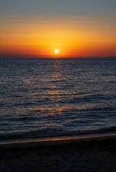 Tranquil scene of beautiful sea at sunset. Orange and yellow sunset on the sea. Aerial panoramic view of sunset over sea.
