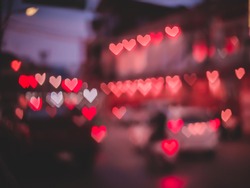 Valentine's day background. Heart bokeh background,Blurred background. Night city lights blur.Abstract image of blur motion of cars on the city road at evening