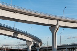 New turning automobile overpasses, bottom view. Modern road infrastructure