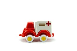 red paint plastic toy ambulance car isolated on white background