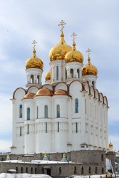 Christian temple. Beautiful large white building with golden domes and crosses. Russian Orthodox Church. Holy Trinity Cathedral, Magadan, Siberia, Far East of Russia.