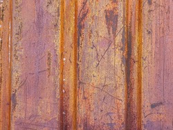 Texture of rusty metal. Rough surface of metal with rust. Corroded and oxidized old iron. Rusted metal wall of the container. Perfect for a Grunge background and design.