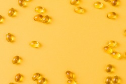 Close up of  oil filled capsules suitable for: fish oil, omega 3, omega 6, omega 9,  vitamin A, vitamin D, vitamin D3, vitamin E 