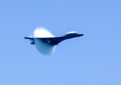 The fighter overcomes the sound barrier, the moment of transition of the sound barrier by plane.