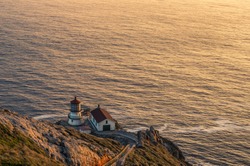 Vibrant and colorful sunset photo of lighthouse at pacific coast USA. Point Reyes Lighthouse near San Francisco California.