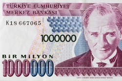 Old historic one million Turkish lira banknote not in use, close-up and top shot, Ataturk portrait on black background. 