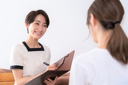 Asian women receiving courteous counseling