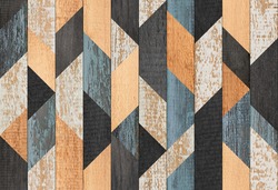 Colorful wooden wall with geometric pattern. Wood texture background. Weathered wooden planks.