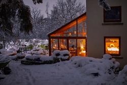 A warm welcome at dusk at the Dales farm cottage in evening snow