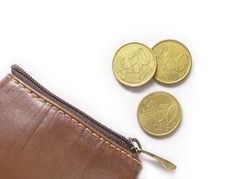 Fifty-cent coins by a leathern purse. European Union coins on white background. EU metal money. 50 Cent Euro Coins