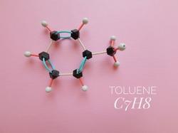 Molecular structure model and chemical formula of toluene molecule. Toluene (toluol) is an aromatic hydrocarbon, a flammable liquid with a pungent odor, it is widely employed as an organic solvent.