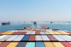 View on the containers loaded on deck of cargo ship. Vessel is transiting Suez Canal on her international trade route. 