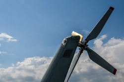 Steering propeller of the helicopter against the blue sky