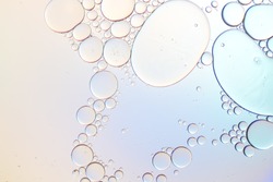Colorful artistic of oil drop floating on the water. Pastel color bubble for background. Fantastic structure of colorful oil bubbles. Abstract oil bubbles background. Macro shot. oil bubbles close up.