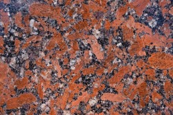 Granite slab in the red, grey, white, black mix. Outdoor.