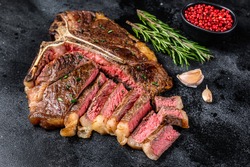 Grilled italian Florentine or t bone beef meat Steak. Black background. Top view.