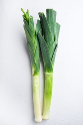 Organic Leek onion Stalks on white background, top view with space for text.