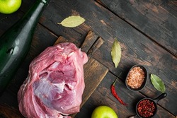 Pork roast, preparation set, with apple dry cider, on old dark  wooden table background, top view flat lay, with copy space for text