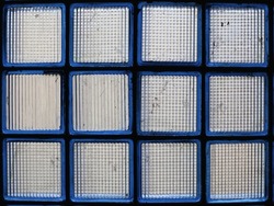 A wall of translucent square glass blocks