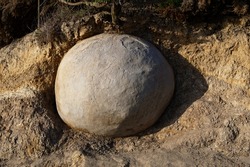 A very round Moeraki boulder in New Zealand