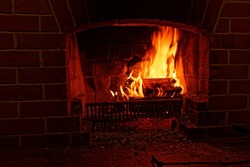Winter warmth, an open fire burns brightly