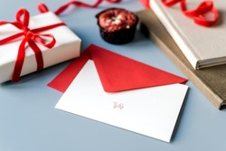 Layout of a postcard with the red number 14 and a beautifully wrapped valentine's gift.