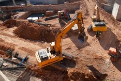 Construction site with yellow tractors
