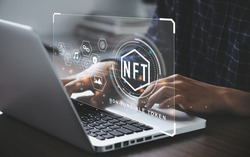 Businessman using a computer for NFT non fungible token for crypto art blockchain technology concept.