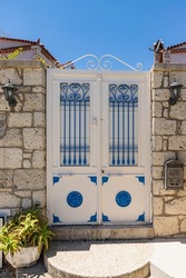 Doors and windows of stone houses in Alaçatı in summer