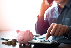 Close-up image of pink piggy bank with money stack step up growing growth. Planning step up, saving money for future plan, retirement fund. Business investment-finance accounting concept.