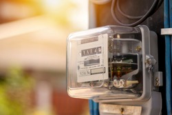 Electricity meters for home electrical appliances, including blurred natural green backgrounds, electric power usage concepts, and electricity usage audits.