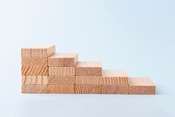 Wooden blocks stacking as step stair. Business growth success. Money business and investment growth and banking concept. Investing money for retirement. Inflation and tax hikes
