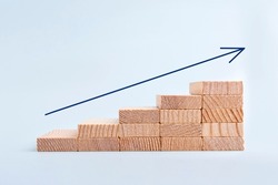 Arrow up of wooden blocks stacking as step stair. Business growth success. Money business and investment growth and banking concept. Investing money for retirement. Inflation and tax hikes