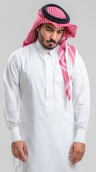 A sad Saudi young man thinks