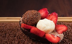 Chocolate Easter Egg filled with brigadeiro (brigadier) and strawberries, Goumert egg chocolate tradition in Brazil.