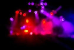 Blurred geometrical magenta and red concert lights (super high resolution) on bright stage lights with Laser rays blur